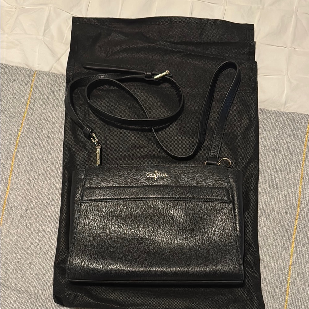 Cole Haan women’s black Leather clutch/crossbody convertible purse